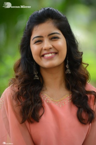 Telugu Actress Amritha Aiyer in a orange dress