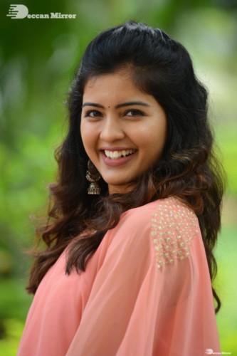 Telugu Actress Amritha Aiyer in a orange dress