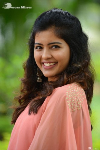 Telugu Actress Amritha Aiyer in a orange dress