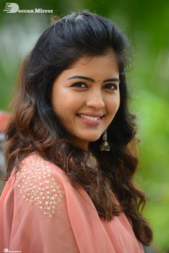 Telugu Actress Amritha Aiyer in a orange dress