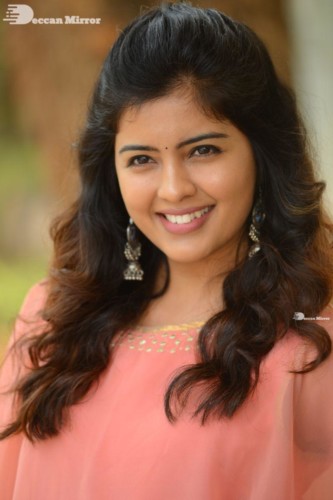 Telugu Actress Amritha Aiyer in a orange dress