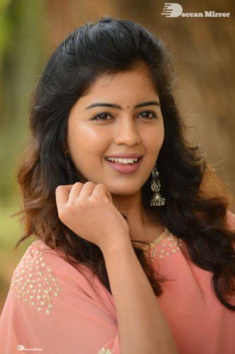 Telugu Actress Amritha Aiyer in a orange dress