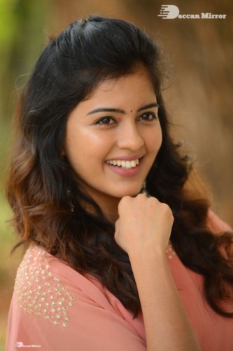 Telugu Actress Amritha Aiyer in a orange dress