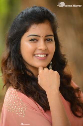 Telugu Actress Amritha Aiyer in a orange dress