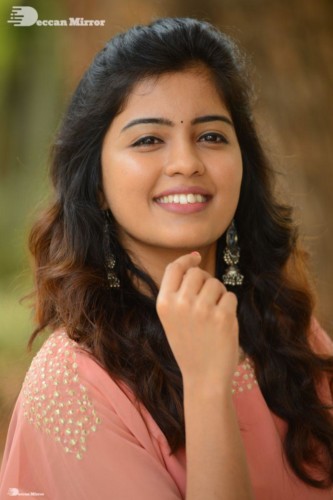 Telugu Actress Amritha Aiyer in a orange dress