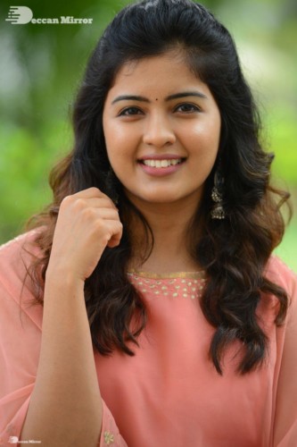 Telugu Actress Amritha Aiyer in a orange dress