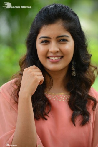 Telugu Actress Amritha Aiyer in a orange dress