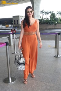 Bollywood Actress Amyra Dastur in a orange dress