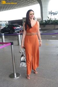 Bollywood Actress Amyra Dastur in a orange dress