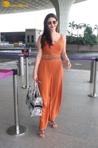 Bollywood Actress Amyra Dastur in a orange dress