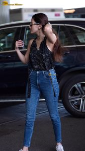 actress amyra dastur pretty in a black top and blue denim jeans