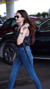 actress amyra dastur pretty in a black top and blue denim jeans