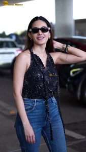 actress amyra dastur pretty in a black top and blue denim jeans