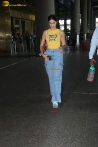 actress Ananya Panday in yellow top and denim jeans