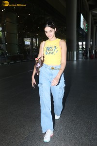 actress Ananya Panday in yellow top and denim jeans