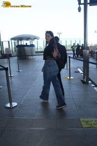 actress Ananya Panday cute in black top and blue denim jeans