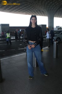 actress Ananya Panday cute in black top and blue denim jeans