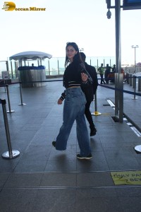 actress Ananya Panday cute in black top and blue denim jeans