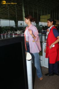 bollywood actress Ananya Panday in a pink shirt and blue denim jeans at mumbai airport