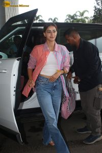 bollywood actress Ananya Panday in a pink shirt and blue denim jeans at mumbai airport
