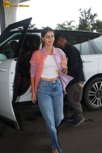 bollywood actress Ananya Panday in a pink shirt and blue denim jeans at mumbai airport