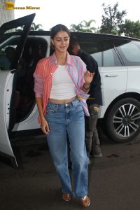 bollywood actress Ananya Panday in a pink shirt and blue denim jeans at mumbai airport