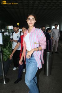 bollywood actress Ananya Panday in a pink shirt and blue denim jeans at mumbai airport