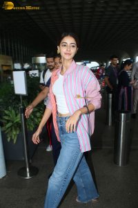 bollywood actress Ananya Panday in a pink shirt and blue denim jeans at mumbai airport