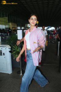 bollywood actress Ananya Panday in a pink shirt and blue denim jeans at mumbai airport