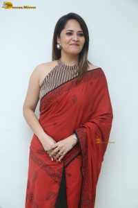 actress Anasuya Bharadwaj beautiful in a red saree
