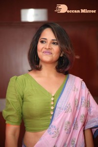 Anasuya Bharadwaj in a green blouse and pink saree