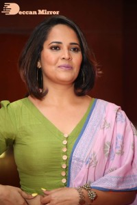 Anasuya Bharadwaj in a green blouse and pink saree