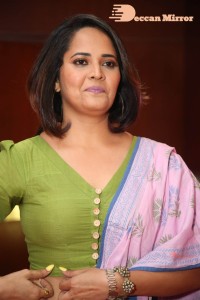 Anasuya Bharadwaj in a green blouse and pink saree