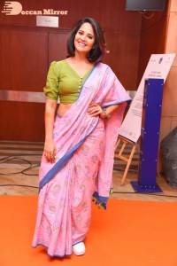 Anasuya Bharadwaj in a green blouse and pink saree