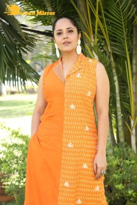 Anchor Anasuya Bharadwaj in a orange salwar kameez dress