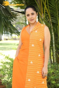 Anchor Anasuya Bharadwaj in a orange salwar kameez dress