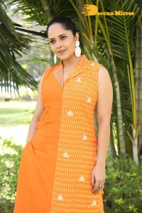 Anchor Anasuya Bharadwaj in a orange salwar kameez dress