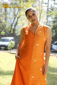 Anchor Anasuya Bharadwaj in a orange salwar kameez dress