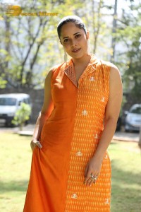 Anchor Anasuya Bharadwaj in a orange salwar kameez dress