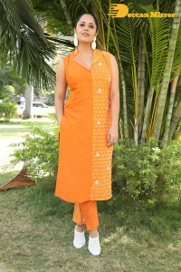 Anchor Anasuya Bharadwaj in a orange salwar kameez dress