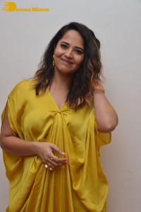 Anchor and Actress Anasuya Bharadwaj photoshoot in a yellow dress