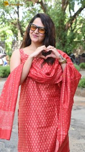 anchor and actress anasuya bharadwaj photoshoot in a red dress