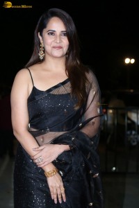 anchor and actress Anasuya Bharadwaj ravishing looks in a black saree