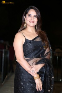 anchor and actress Anasuya Bharadwaj ravishing looks in a black saree