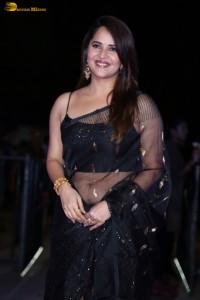 anchor and actress Anasuya Bharadwaj ravishing looks in a black saree