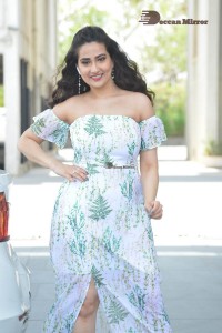 Television Anchor Manjusha poses in a white floral dress