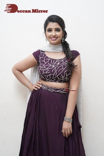 TV Anchor Syamala poses for pictures in a purple dress