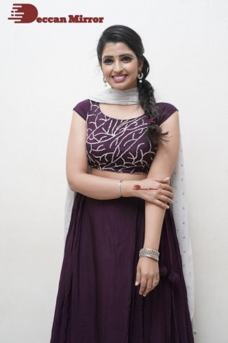 TV Anchor Syamala poses for pictures in a purple dress