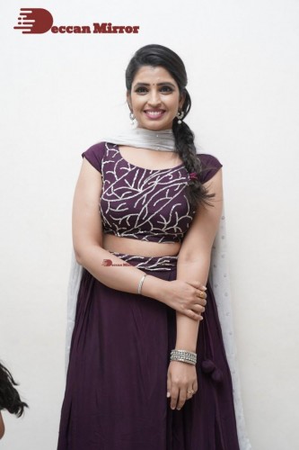 TV Anchor Syamala poses for pictures in a purple dress