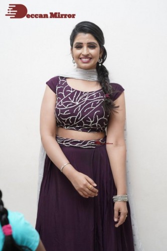 TV Anchor Syamala poses for pictures in a purple dress